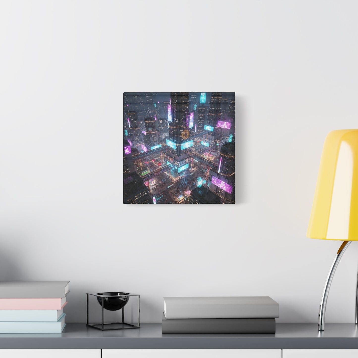 Framed cityscape artwork on a wall above a desk with books and a lamp.