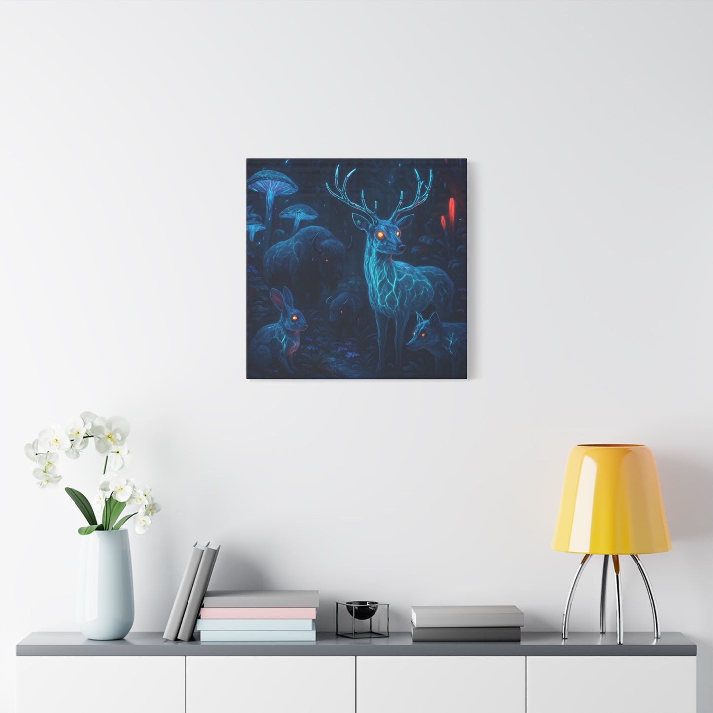Framed artwork of a deer in a forest on a white wall above a shelf with decor items.