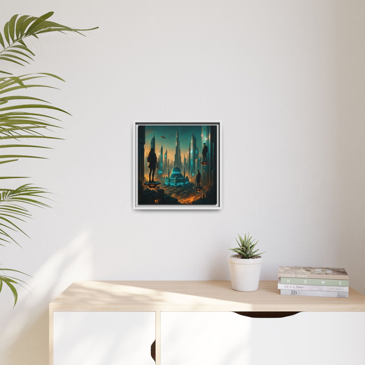 Framed artwork of a fantasy landscape on a wall above a desk with a plant and books.