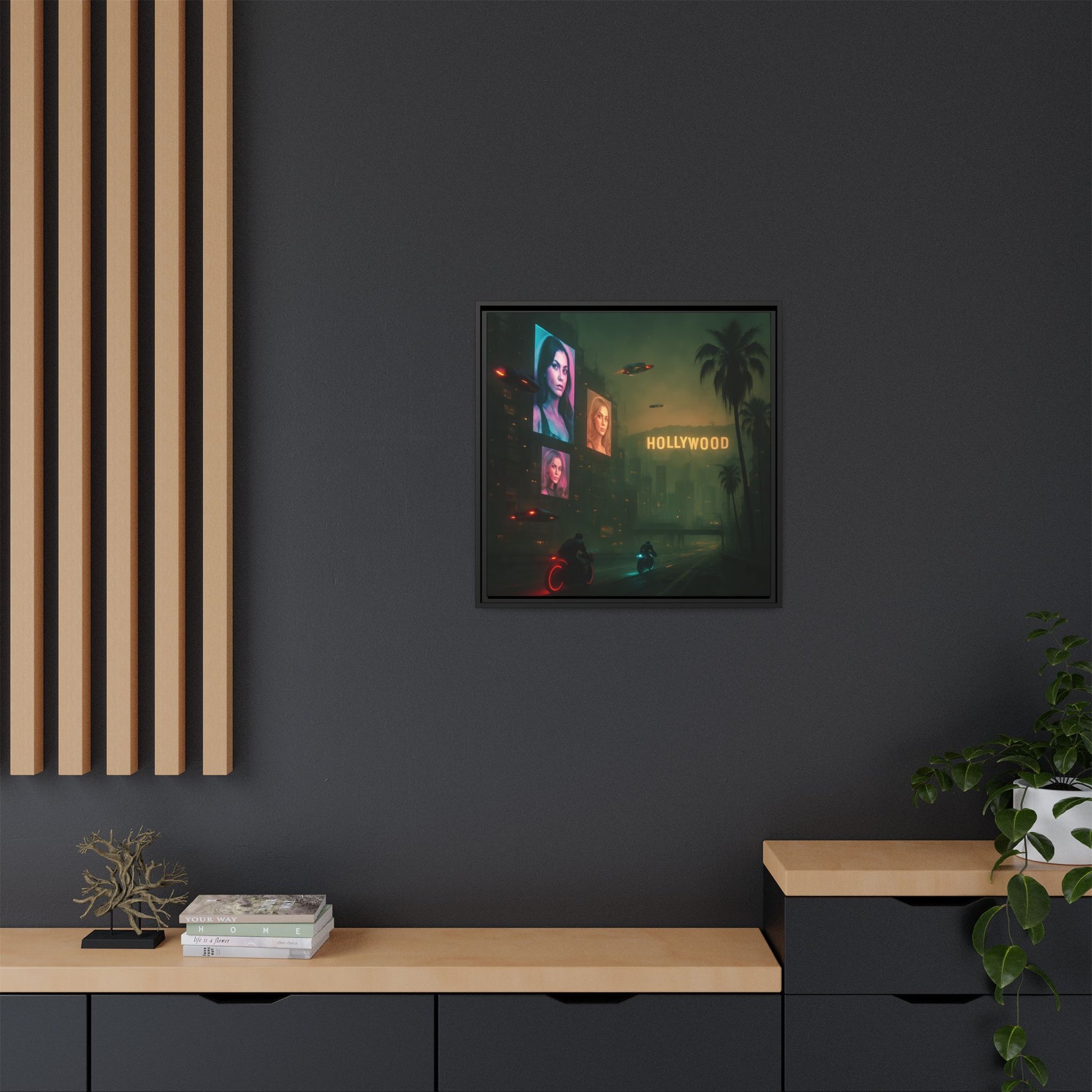 Framed artwork of a neon-lit street scene with 'Hollywood' sign on a dark wall.